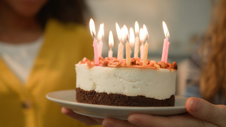 birthday-cake-lit-candles-presented.jpg