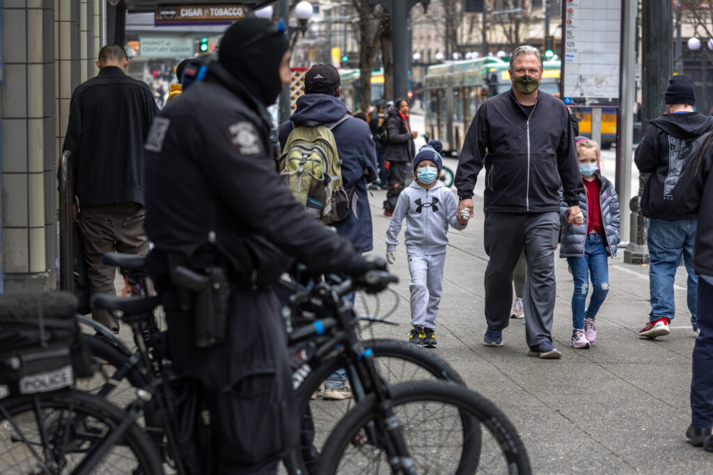 family-walks-past-seattle-police.jpg