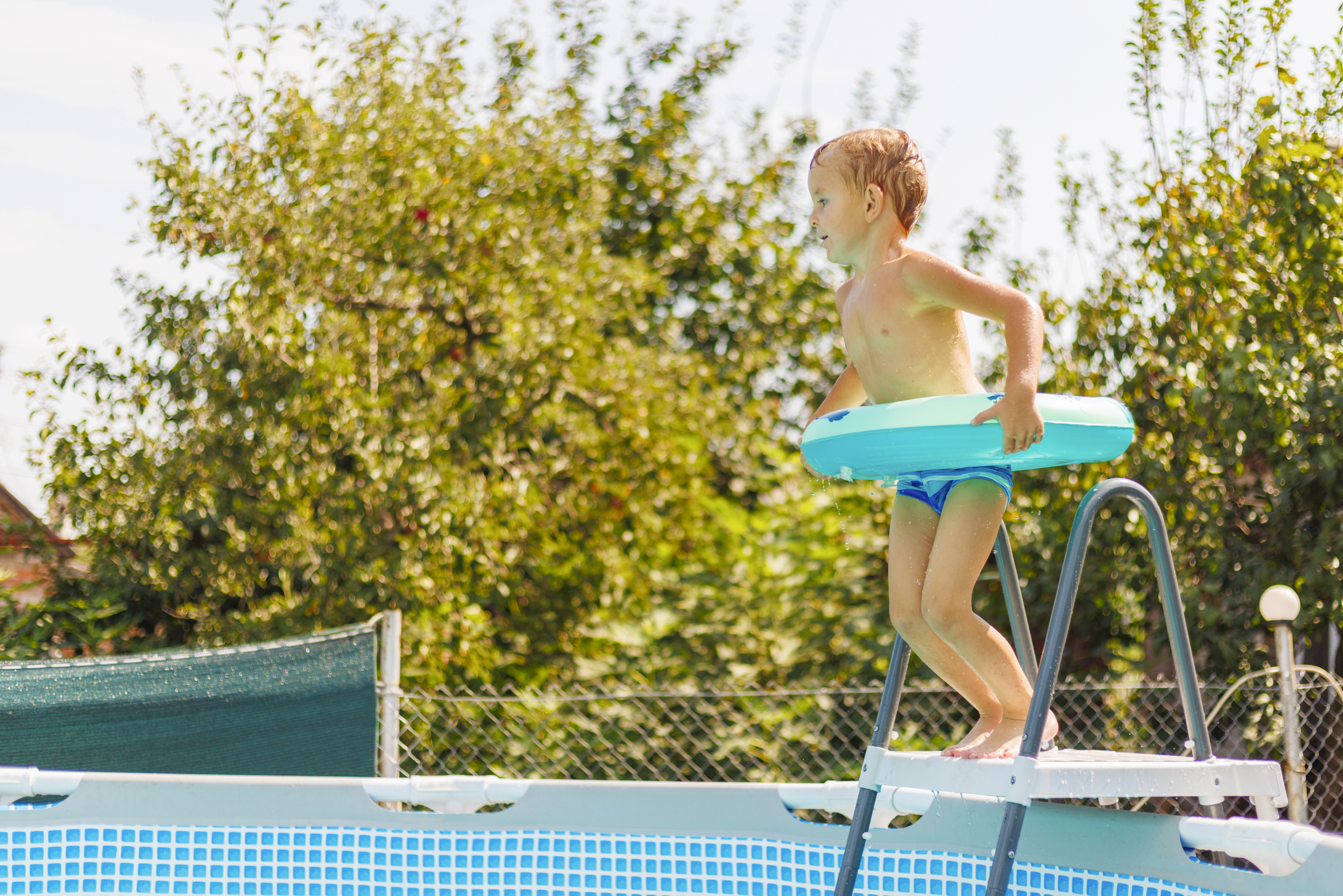 child-jumping-above-ground-pool.jpg