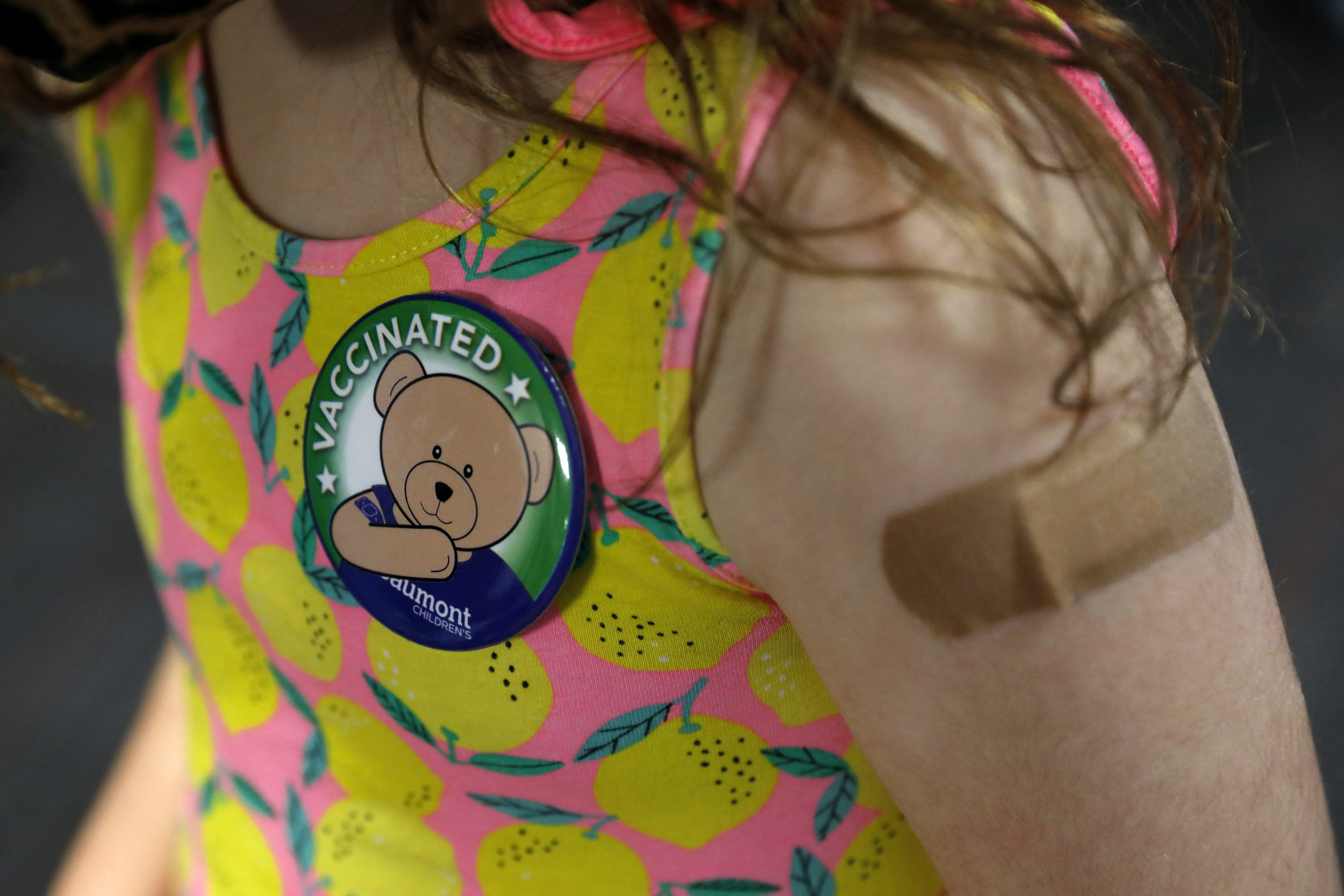 child-wears-pin-she-received.jpg