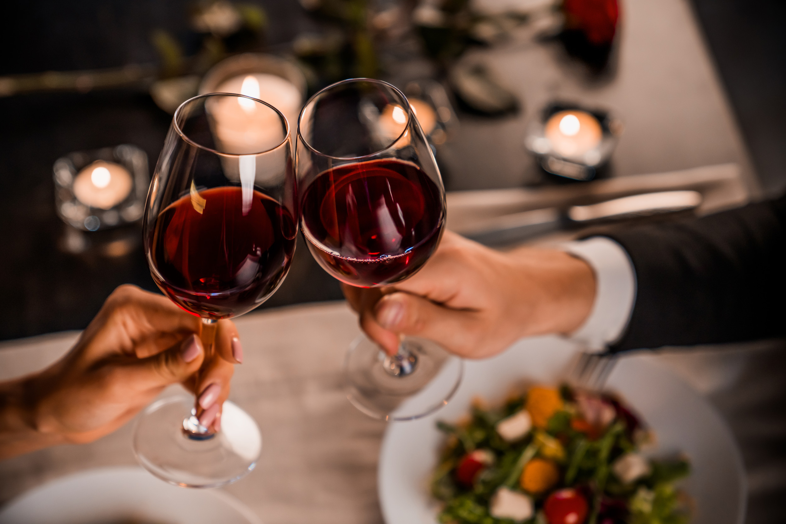 hands-holding-two-glasses-wine.jpg